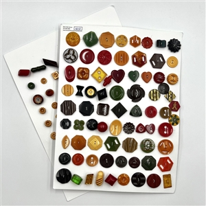 Two cards of 147 vintage Bakelite buttons. 