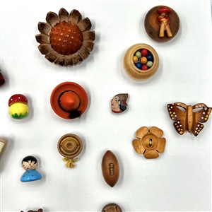 Two cards of 99 wood buttons. 