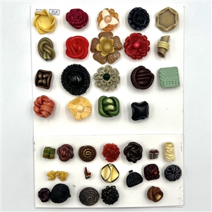 Card of thirty seven vintage extruded and other celluloid buttons. 