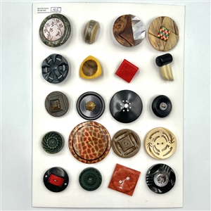 Card of twenty large vintage celluloid, casein and plastic buttons. 