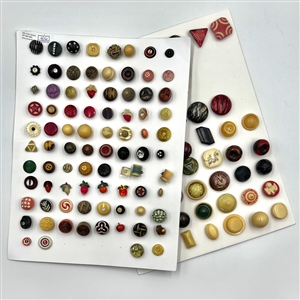 Two cards of 121 vintage plastic buttons.