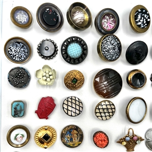 Card of fifty six assorted buttons.