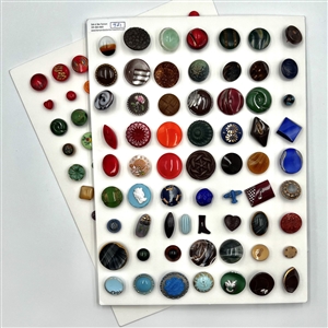 Two cards of 151 clear and colored glass buttons. 