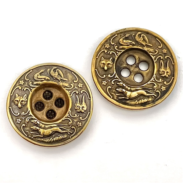 Two very unusual sporting target sew-thru buttons.