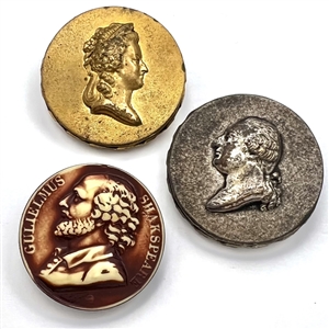Three large buttons of famous people.