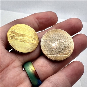 Two gilded brass sporting running hound and fox.