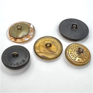 Five sporting buttons of various materials.