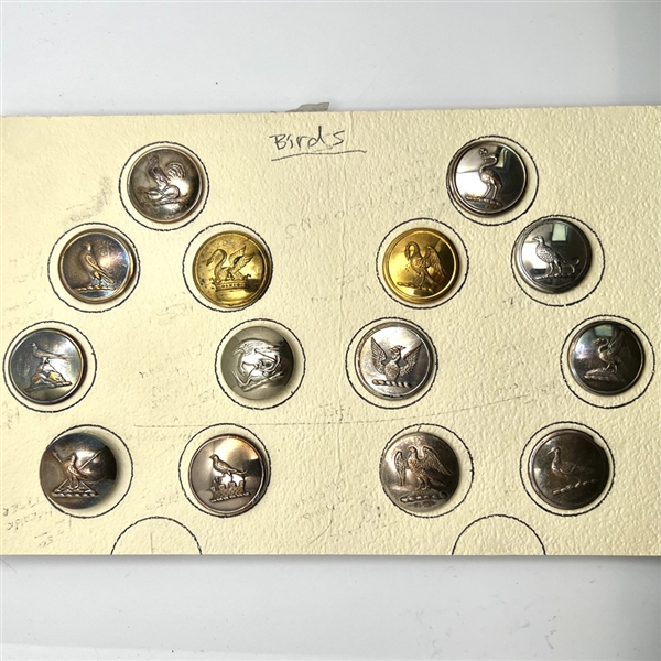 Card of 14 Livery crest bird buttons. 