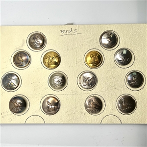 Card of 14 Livery crest bird buttons. 