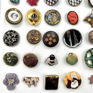 Card of fifty six assorted buttons.