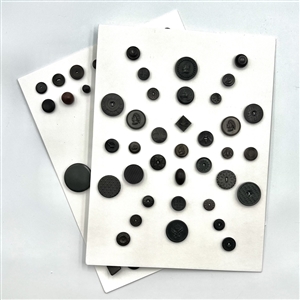 Two cards of 51 Goodyear rubber and other rubber buttons.