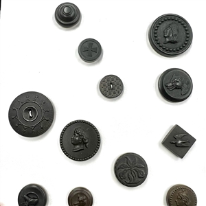 Two cards of 51 Goodyear rubber and other rubber buttons.