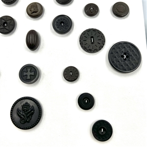 Two cards of 51 Goodyear rubber and other rubber buttons.