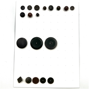 Two cards of 51 Goodyear rubber and other rubber buttons.