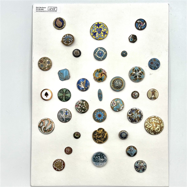 Card of 35 enamel buttons.