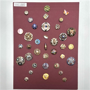 Card of 36 enamel buttons. 