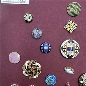 Card of 36 enamel buttons. 