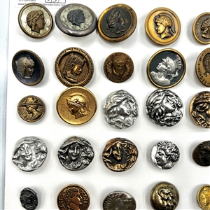 Card of 63 buttons of heads.
