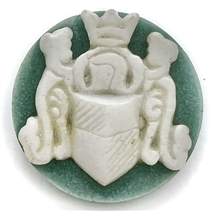 Acrylic shot button of a coat of arms.