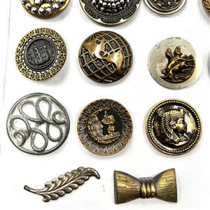 Card of 35 assorted pictorial metal buttons.