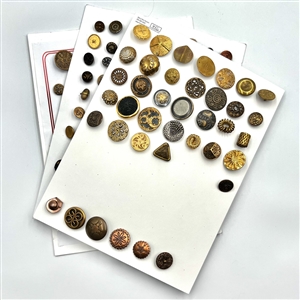 Three cards of 137 assorted metal buttons. 