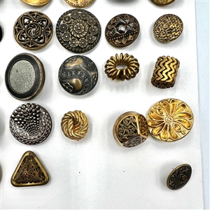 Three cards of 137 assorted metal buttons. 