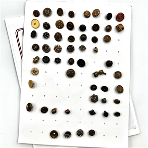 Three cards of 137 assorted metal buttons. 