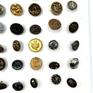 Card of 87 small metal picture buttons. 
