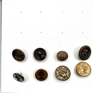 Two cards of 99 metal picture buttons. 