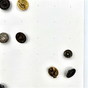 Two cards of 99 metal picture buttons. 
