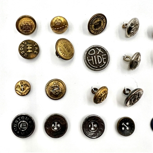 Two cards of 102 steel, brass and other metal buttons. 