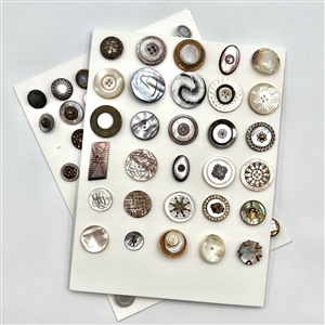 Two cards of 63 pearl and shell buttons. 