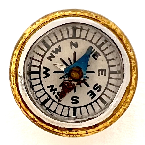 Working compass button. 