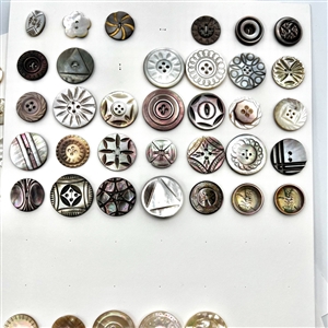 Three cards of 133 pearl and shell buttons. 