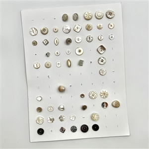 Three cards of 133 pearl and shell buttons. 