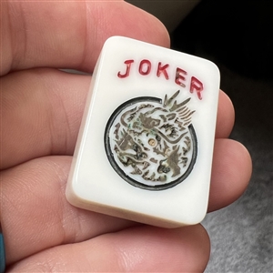 Set of five plastic mahjong buttons.
