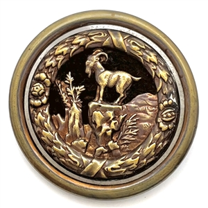 Velvet background fable button of a “Mountain Goat on a Rocky Crag."