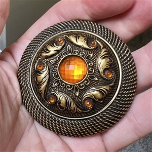 Victorian jewel button with faceted amber colored pastes.