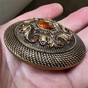 Victorian jewel button with faceted amber colored pastes.