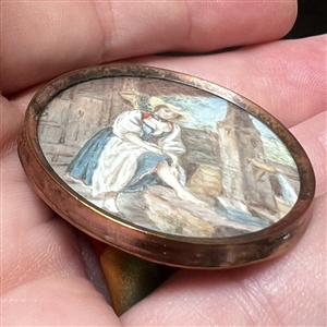An 18th c. Naughty button - painting on natural material of woman washing her leg.