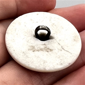 An 18th c. Transfer and painted porcelain button with silver pin shank.