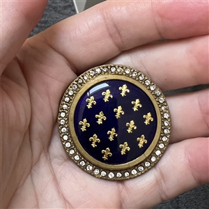 A 19th c.cobalt enamel button with foil Fleur-de-lys and paste border. 