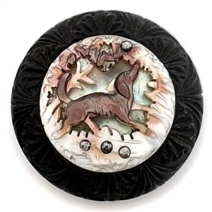 EXQUISITE cameo carved pearl with open work of dog in foliage riveted to wood button with cut-steels.