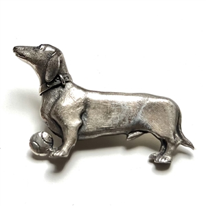 Cast silver button of a dachshund by Sid Bell. 