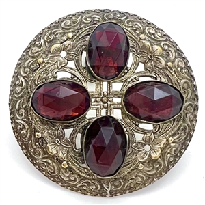 Victorian jewel button with faceted purple oval glass “jewels".