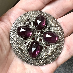 Victorian jewel button with faceted purple oval glass “jewels.