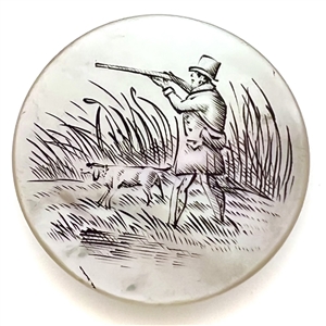 A 19th c. Pearl sporting button of a hunter with gun and dog. 
