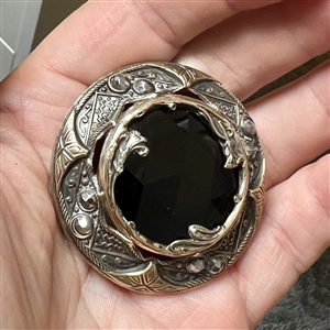 Gorgeous true Gay 90's button with faceted black glass center, cut-steels and inner border of flowers. 