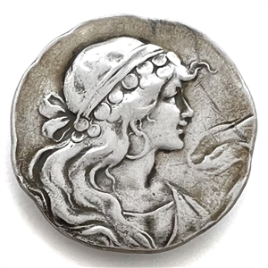 Sterling silver button of a Gypsy woman in profile.