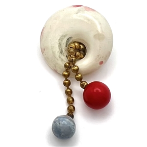 Casein button with movable balls on chain.